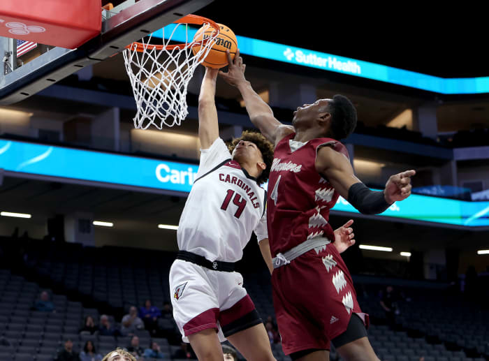 Alemany's Bourgeois Tshilobo (4) and Demarco Hunter (14) go up for rebound.